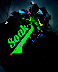 SOAK APPAREL SHIRT green soak with the pink apparel letters